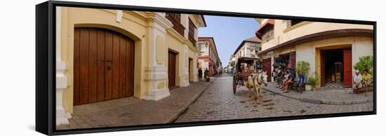 Kalesa moving along Calle Crisologo, Vigan, Ilocos Sur, Philippines-null-Framed Stretched Canvas