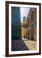 Kalta Minor minaret, Khiva. Uzbekistan, Central Asia. Woman walking near the minaret.-ClickAlps-Framed Photographic Print