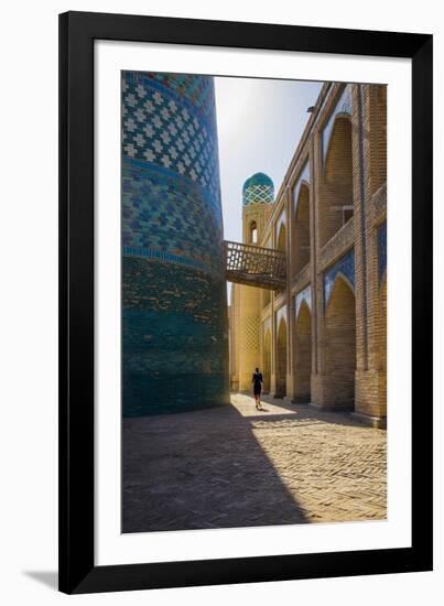 Kalta Minor minaret, Khiva. Uzbekistan, Central Asia. Woman walking near the minaret.-ClickAlps-Framed Photographic Print