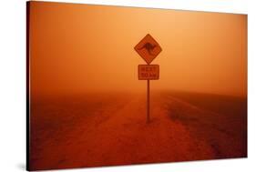 Kangaroo Crossing Sign in Dust Storm in the Australian Outback-Paul Souders-Stretched Canvas