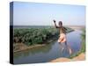 Karo Boy Leaps Off a Cliff Over the Omo River, Ethiopia-Janis Miglavs-Stretched Canvas