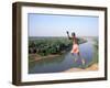 Karo Boy Leaps Off a Cliff Over the Omo River, Ethiopia-Janis Miglavs-Framed Premium Photographic Print