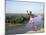 Karo Boy Leaps Off a Cliff Over the Omo River, Ethiopia-Janis Miglavs-Mounted Premium Photographic Print