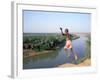 Karo Boy Leaps Off a Cliff Over the Omo River, Ethiopia-Janis Miglavs-Framed Photographic Print