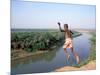 Karo Boy Leaps Off a Cliff Over the Omo River, Ethiopia-Janis Miglavs-Mounted Photographic Print