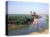 Karo Boy Leaps Off a Cliff Over the Omo River, Ethiopia-Janis Miglavs-Stretched Canvas