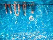 Children's and Adults Legs Underwater in the Swimming Pool-Kateryna Mostova-Mounted Photographic Print