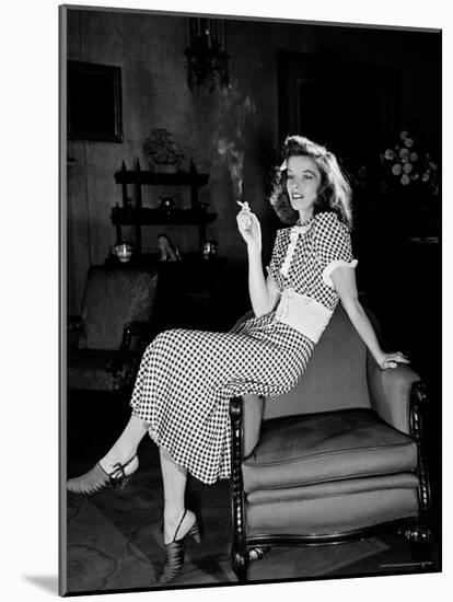 Katharine Hepburn in chair Smoking Cigarette in Scene from Broadway Show "The Philadelphia Story"-Alfred Eisenstaedt-Mounted Premium Photographic Print