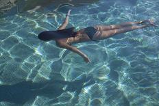 Spain, Ibiza, Cala Jondal. Girl Swimming at Maison De Bang Bang Villa-Katie Garrod-Photographic Print