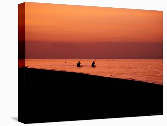 Kayaking into the Sunset, Indonesia-Michael Brown-Stretched Canvas