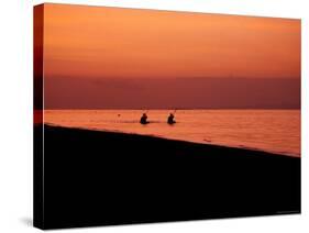 Kayaking into the Sunset, Indonesia-Michael Brown-Stretched Canvas