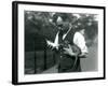 Keeper Harry Warwick Bottle Feeds a Baby Warthog at London Zoo, in August 1922-Frederick William Bond-Framed Photographic Print