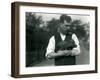 Keeper Harry Warwick Cradles a Baby Warthog in His Arms at London Zoo, August 1922-Frederick William Bond-Framed Premium Photographic Print