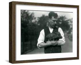 Keeper Harry Warwick Cradles a Baby Warthog in His Arms at London Zoo, August 1922-Frederick William Bond-Framed Photographic Print