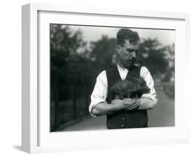 Keeper Harry Warwick Cradles a Baby Warthog in His Arms at London Zoo, August 1922-Frederick William Bond-Framed Photographic Print