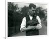 Keeper Harry Warwick Cradles a Baby Warthog in His Arms at London Zoo, August 1922-Frederick William Bond-Framed Photographic Print