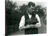 Keeper Harry Warwick Cradles a Baby Warthog in His Arms at London Zoo, August 1922-Frederick William Bond-Stretched Canvas