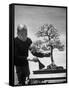 Keibun Tanaka Brushing Away Fallen Leaves of a Bonsai Maple Tree in Garden, Suburban Tokyo-Alfred Eisenstaedt-Framed Stretched Canvas
