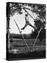 Kenneth Merriman Swinging on Tree Limb After Kicking Away Stilts-Robert W^ Kelley-Stretched Canvas