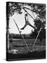 Kenneth Merriman Swinging on Tree Limb After Kicking Away Stilts-Robert W^ Kelley-Stretched Canvas