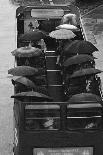 Tourists under Umbrellas on Open Top Bus, 1976-Kent Gavin-Mounted Photographic Print