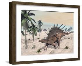 Kentrosaurus Dinosaurs Walking in the Desert Among Palm Trees-null-Framed Art Print