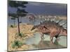 Kentrosaurus Dinosaurs Walking in the Water Next to Sand and Trees-null-Mounted Art Print