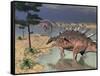 Kentrosaurus Dinosaurs Walking in the Water Next to Sand and Trees-null-Framed Stretched Canvas