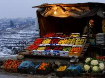 A Palestinian Fruit and Vegetable Vendor Waits for Customers-Kevin Frayer-Premium Photographic Print