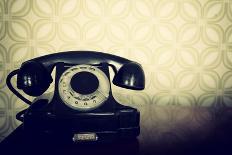 Vintage Old Telephone, Black Retro Phone Is On Wooden Table Over Green Old-Fashioned Wallpaper-khorzhevska-Art Print