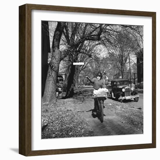 Kid Football Player Delivering Newspapers-Francis Miller-Framed Photographic Print