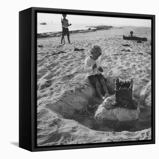 Kid Playing in Sand-Martha Holmes-Framed Stretched Canvas