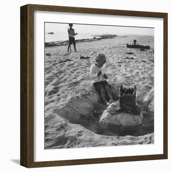 Kid Playing in Sand-Martha Holmes-Framed Photographic Print