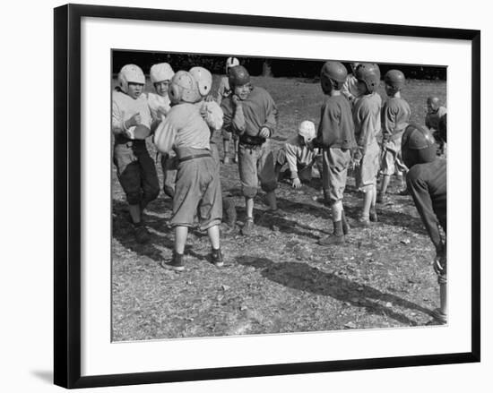 Kid's Football, Talking it over During Scrimmage-null-Framed Photographic Print