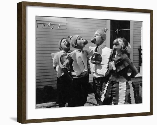 Kids Biting Apples on Strings at Halloween-null-Framed Photo