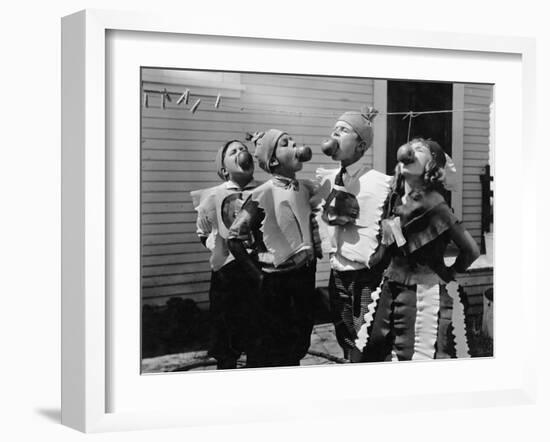 Kids Biting Apples on Strings at Halloween-null-Framed Photo