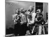 Kids Biting Apples on Strings at Halloween-null-Mounted Photo