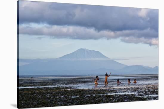 Kids Playing in the Water on the Coast of Bali-Alex Saberi-Stretched Canvas