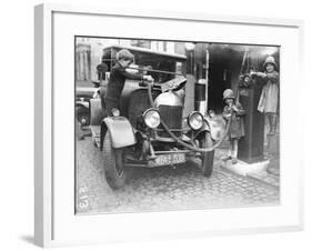 Kids Refuelling a Car-null-Framed Photographic Print