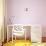 Kids Safety Concept- Little Girl Climbing on Baby Chair-NadyaEugene-Photographic Print displayed on a wall