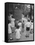 Kids Watching Outdoor Puppet Show-Dmitri Kessel-Framed Stretched Canvas