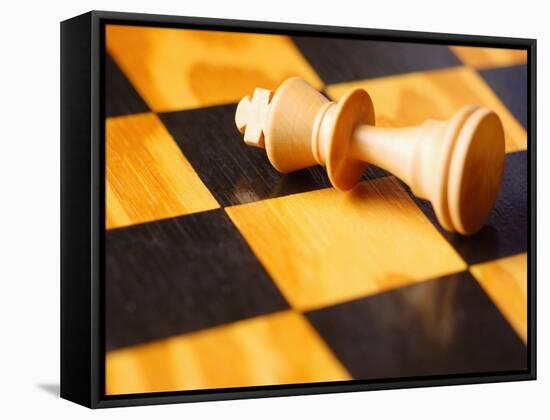 King chess piece lying on chessboard-null-Framed Stretched Canvas