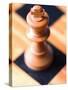 King chess piece on chessboard-null-Stretched Canvas