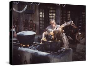 Kirk Douglas Dunking Enemy's Head in Giant Cook Pot in Scene From Stanley Kubrick's "Spartacus"-J^ R^ Eyerman-Stretched Canvas