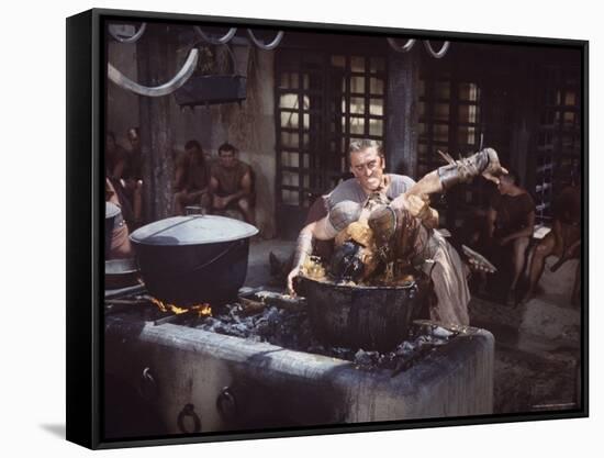 Kirk Douglas Dunking Enemy's Head in Giant Cook Pot in Scene From Stanley Kubrick's "Spartacus"-J^ R^ Eyerman-Framed Stretched Canvas