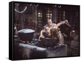 Kirk Douglas Dunking Enemy's Head in Giant Cook Pot in Scene From Stanley Kubrick's "Spartacus"-J^ R^ Eyerman-Framed Stretched Canvas