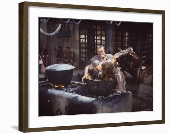 Kirk Douglas Dunking Enemy's Head in Giant Cook Pot in Scene From Stanley Kubrick's "Spartacus"-J^ R^ Eyerman-Framed Premium Photographic Print