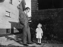 Father and Son Look at Each Other on Sidewalk, Ca. 1930.-Kirn Vintage Stock-Photographic Print