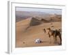 Kneeling to Pray in Desert, Holding Camels by Halters to Prevent Them Wandering Off Amongst Dunes-John Warburton-lee-Framed Photographic Print