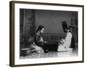 Korean Man and Woman Playing a Game Photograph - Korea-Lantern Press-Framed Art Print